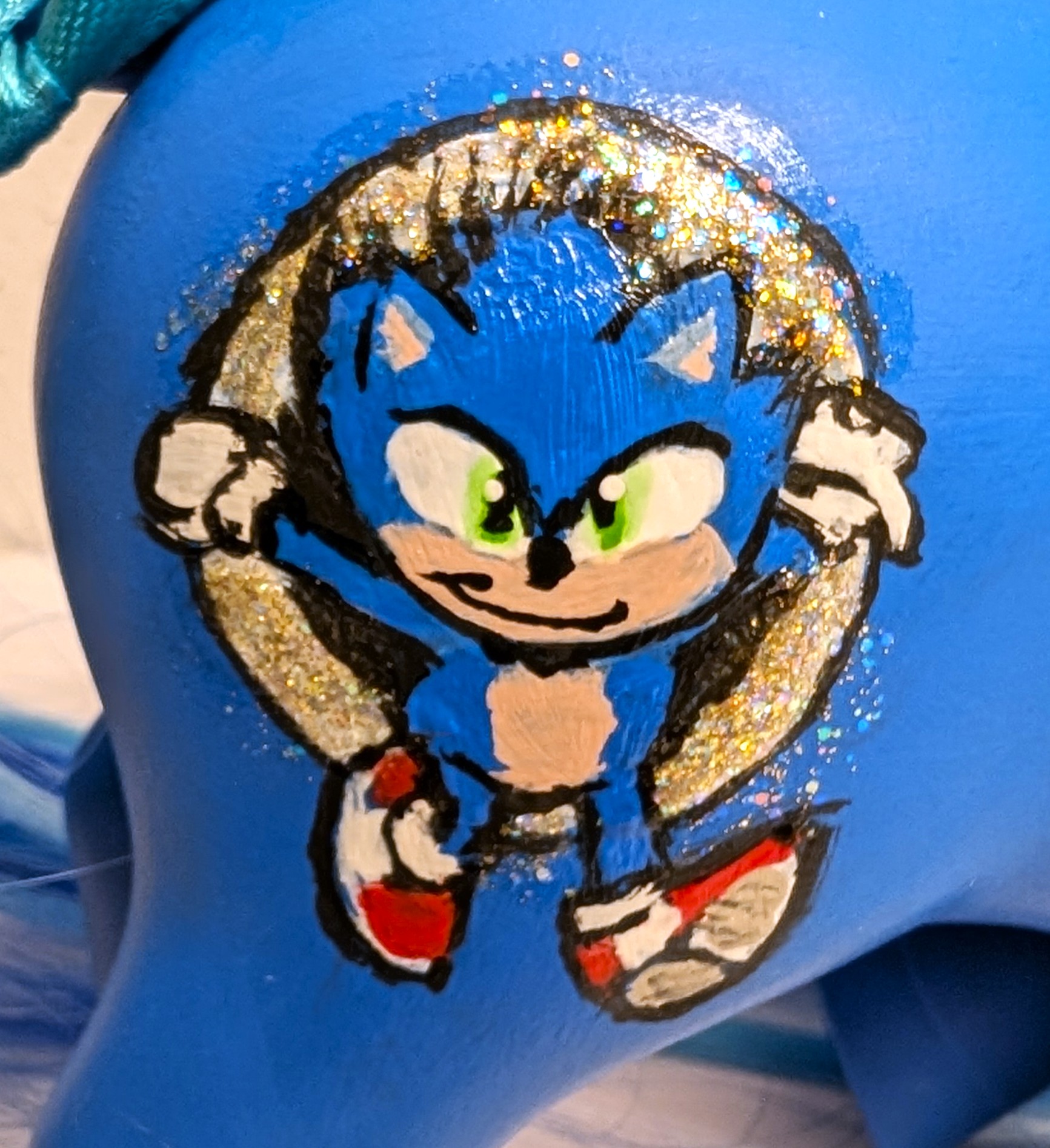 Closeup of Sonic movie pony symbols (Sonic running through a Power Ring)