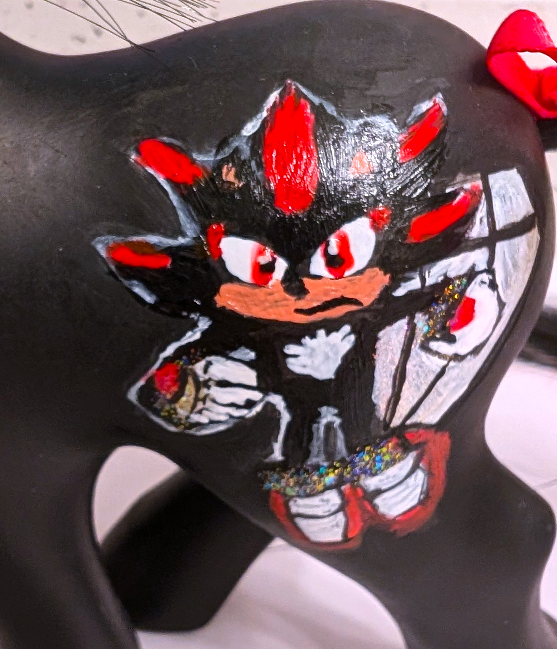 Closeup of Shadow movie pony symbols (Shadow with that damn 4th Chaos Emerald)
